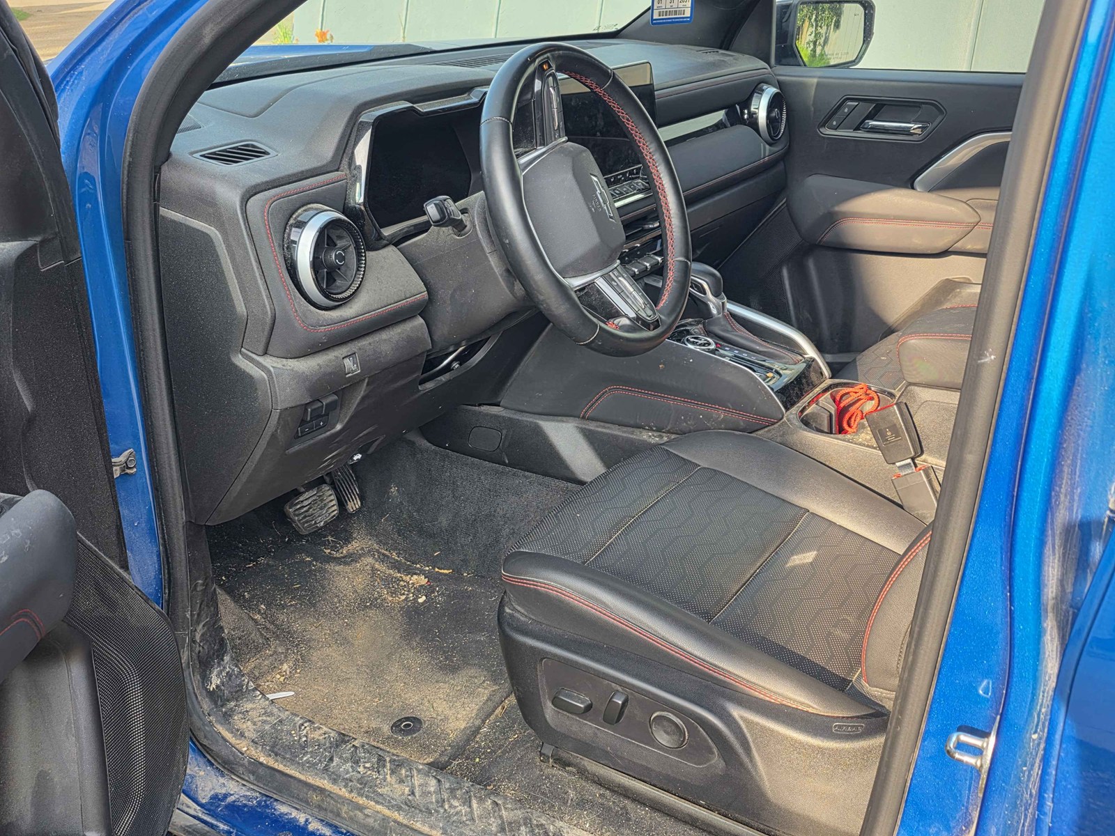 Driver&rsquo;s floor and seat area before Revival Deep Clean detail