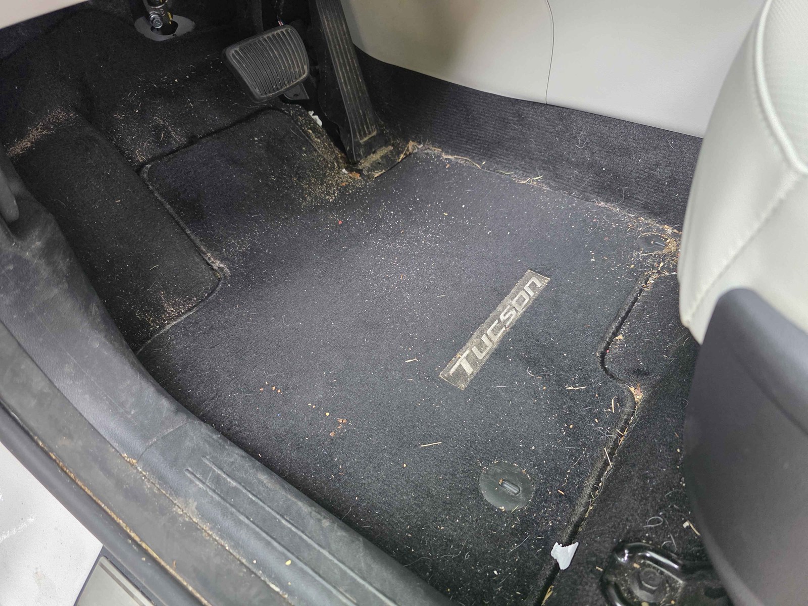 Driver&rsquo;s floor mat before Revival Refresh detail